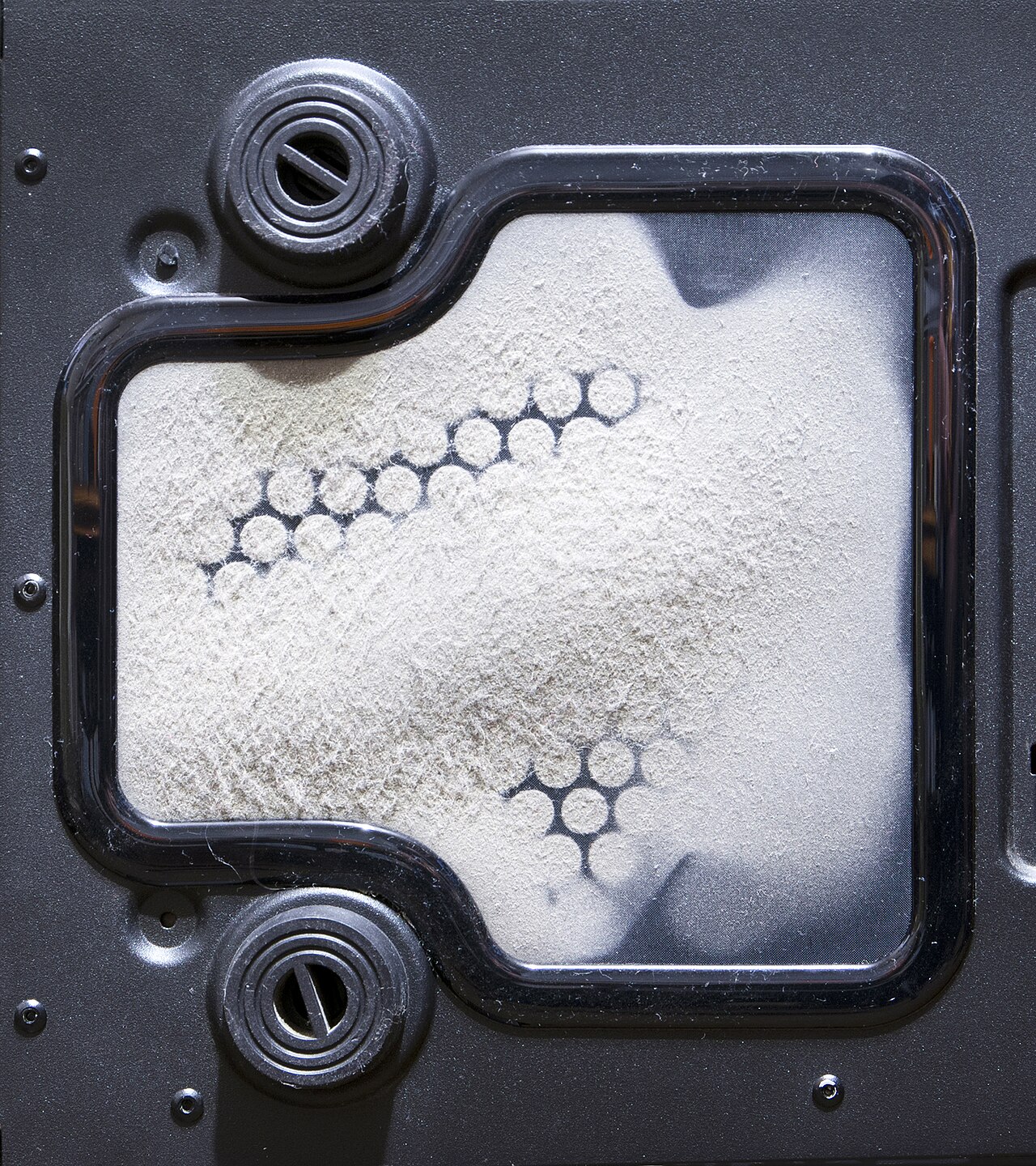 Air filter held up for inspection — a loaded filter is the first thing to check when the AC is not cold