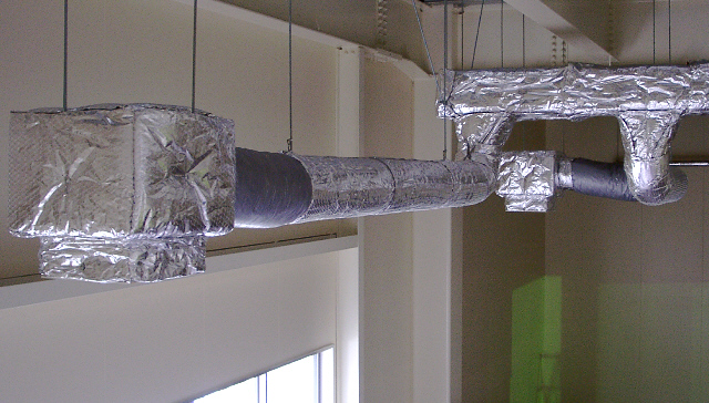 Foil-wrapped insulated ductwork in a ceiling space